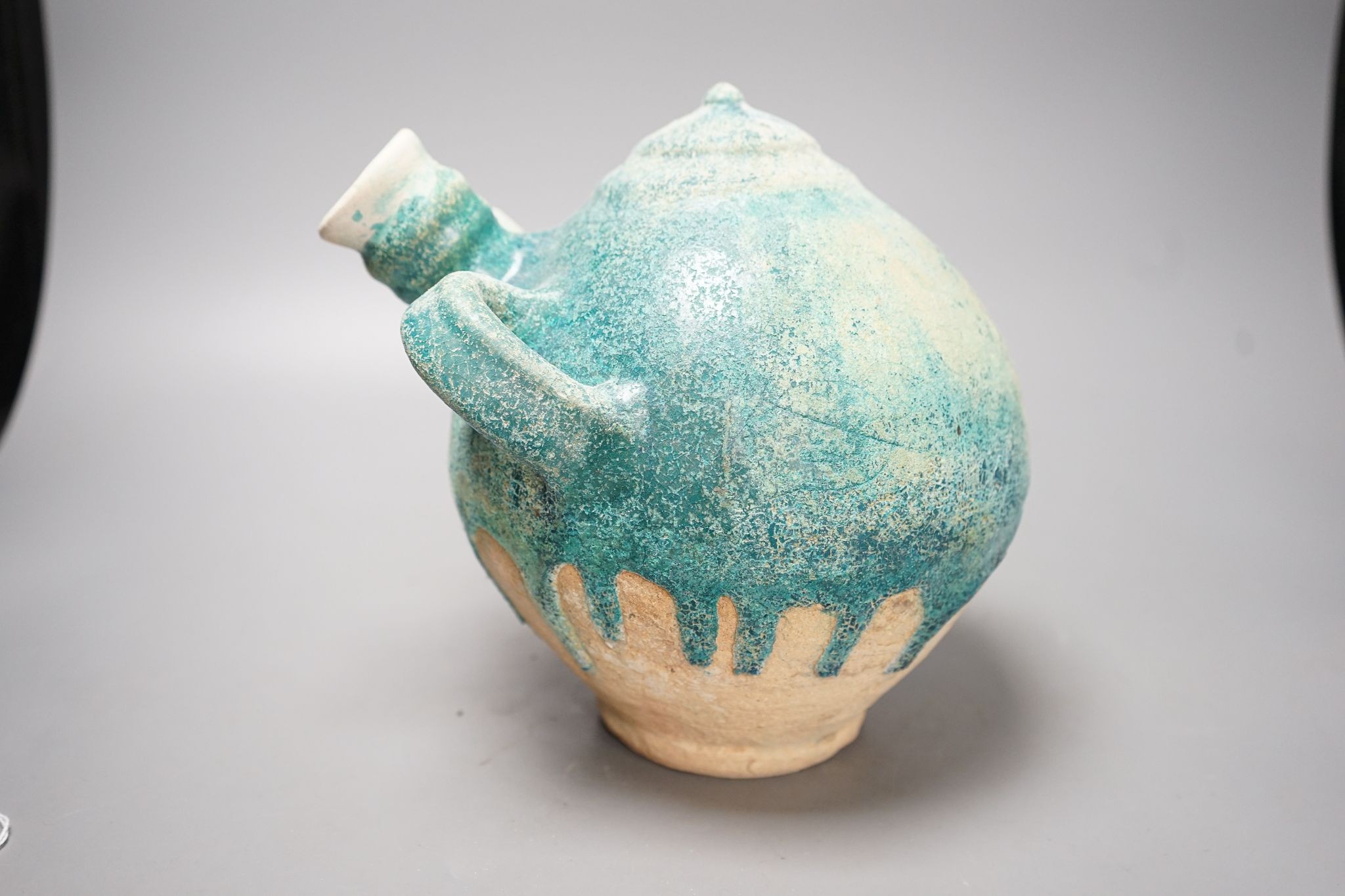 A Kashan turquoise glazed azed jar, 13th/14th century, 22cm